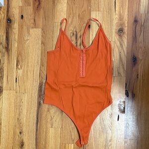 Windsor Orange Ribbed Snap-Front Bodysuit
